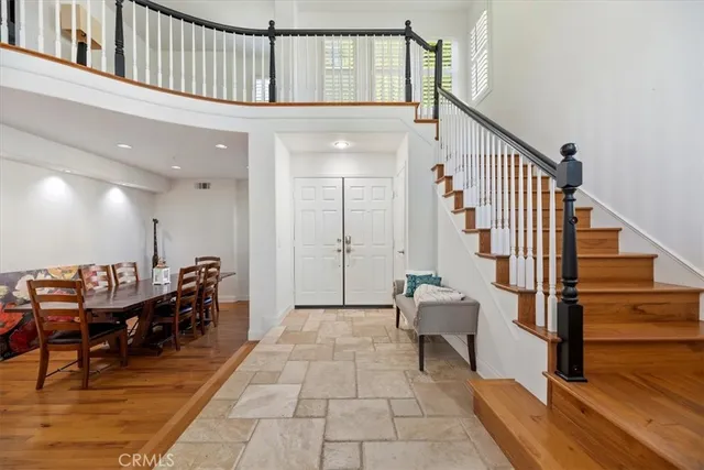 a view of entryway with wooden floor and stairs