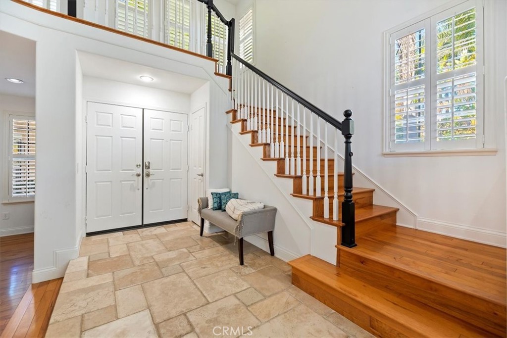 2310 Crown Point Court Oxnard, CA 93036 - Photo 7 of 50 a view of entryway with wooden floor and stairs
