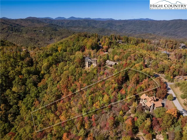 a living room with hard wood flooring and furniture