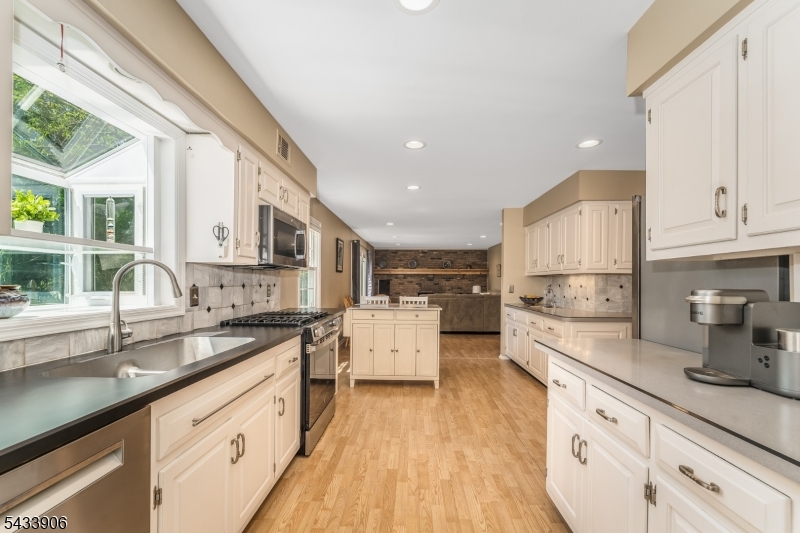 14 Lexington Road Annandale, NJ 08801 - Photo 14 of 47 an open kitchen with granite countertop white cabinets and white appliances