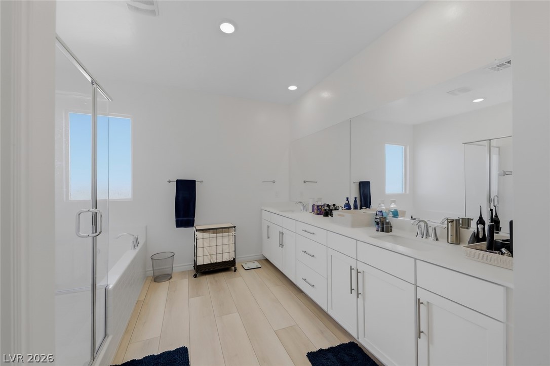 290 Rusty Ridge Lane Henderson, NV 89015 - Photo 16 of 61 Primary bath w/dual sinks, quartz counters, sep shower & soaking tub.