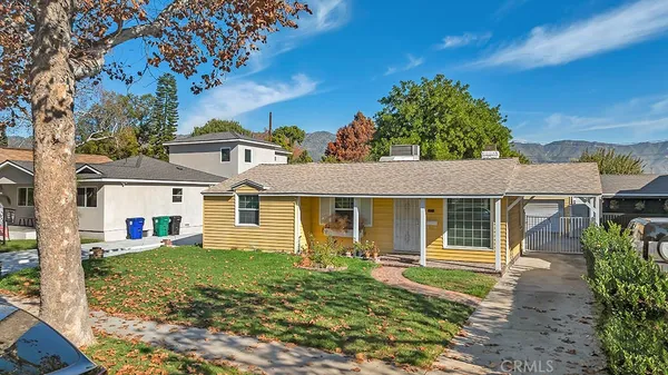 front view of a house with a yard
