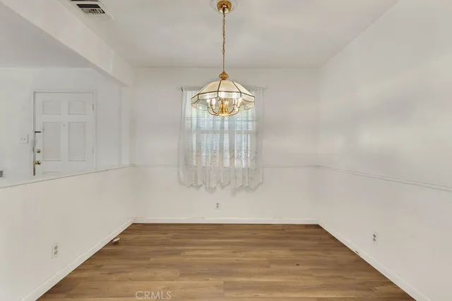 a view of an empty room with glass door