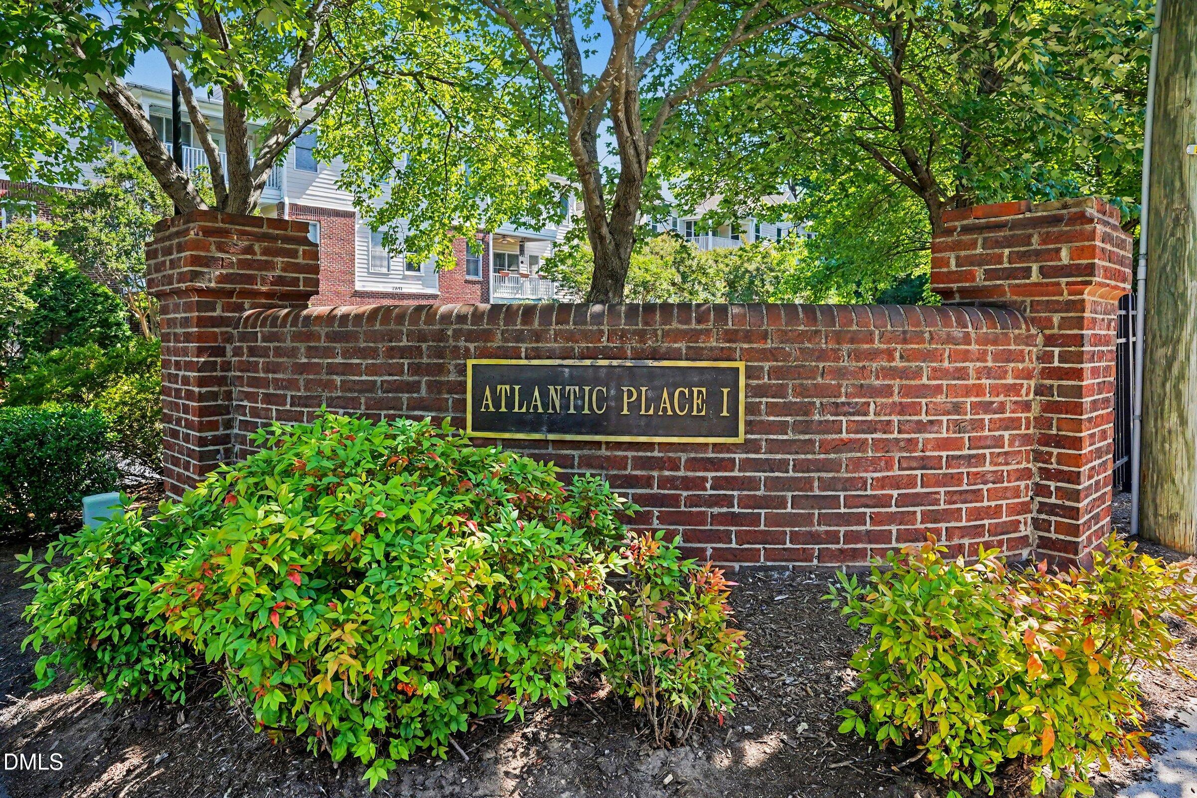 2651 Mellowfield Drive, Unit 203 Raleigh, NC 27604 - Photo 27 of 32 a brick building with a bench in front of it