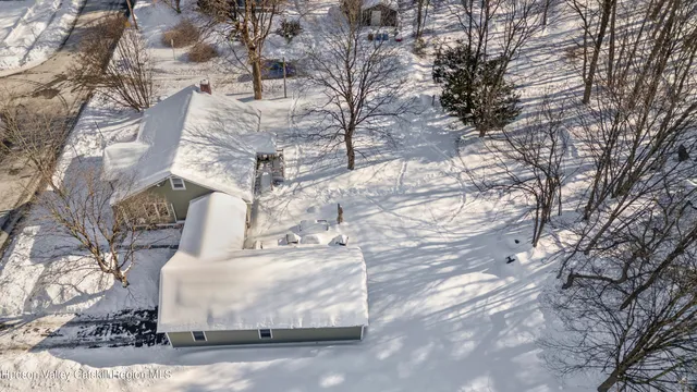 a white house covered with snow