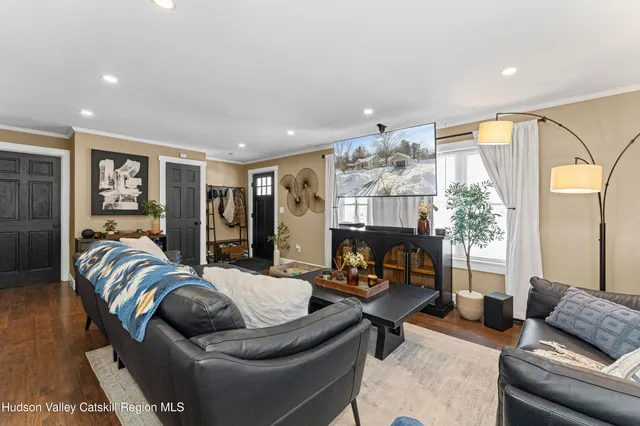 a living room with furniture and a fireplace