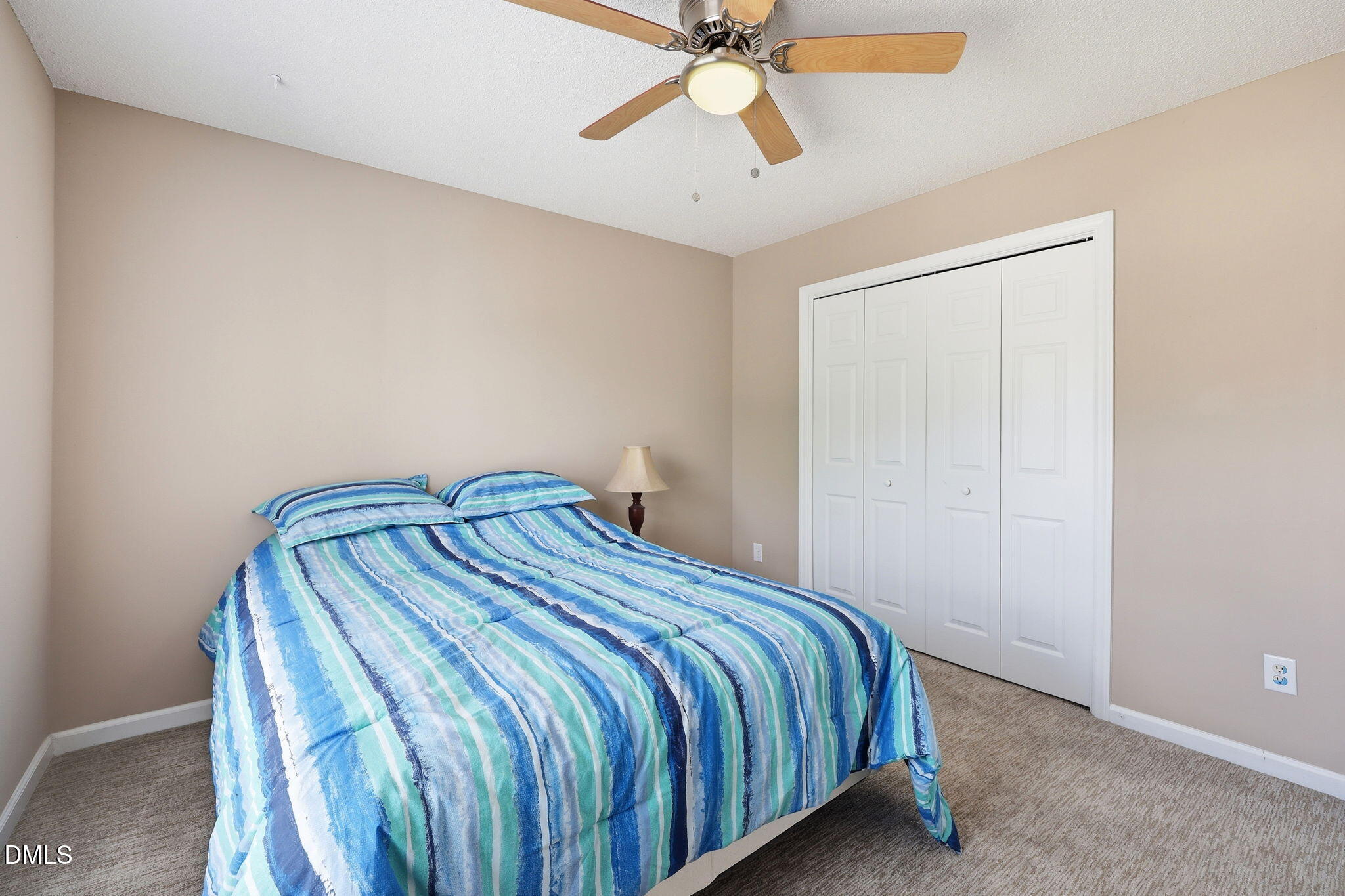 9105 Willow Valley Court Raleigh, NC 27617 - Photo 26 of 51 a bedroom with a bed and fan