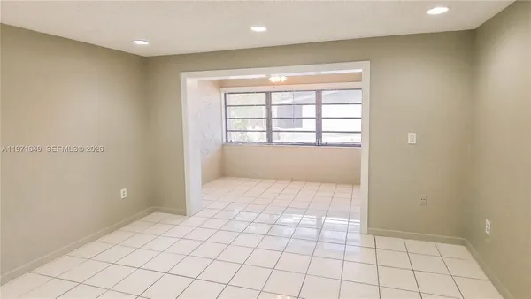 a view of an empty room and window