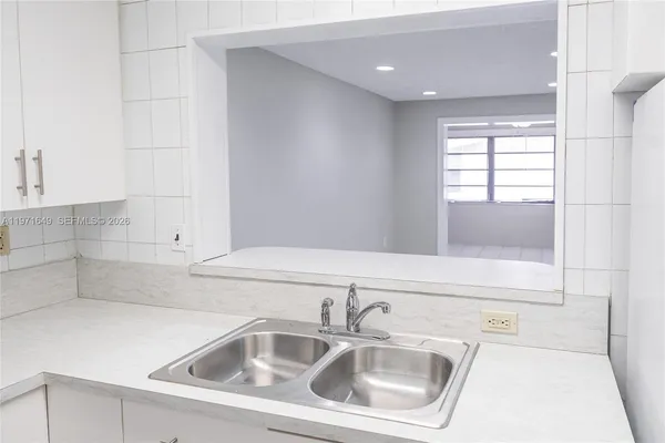 a stove top oven sitting inside of a kitchen