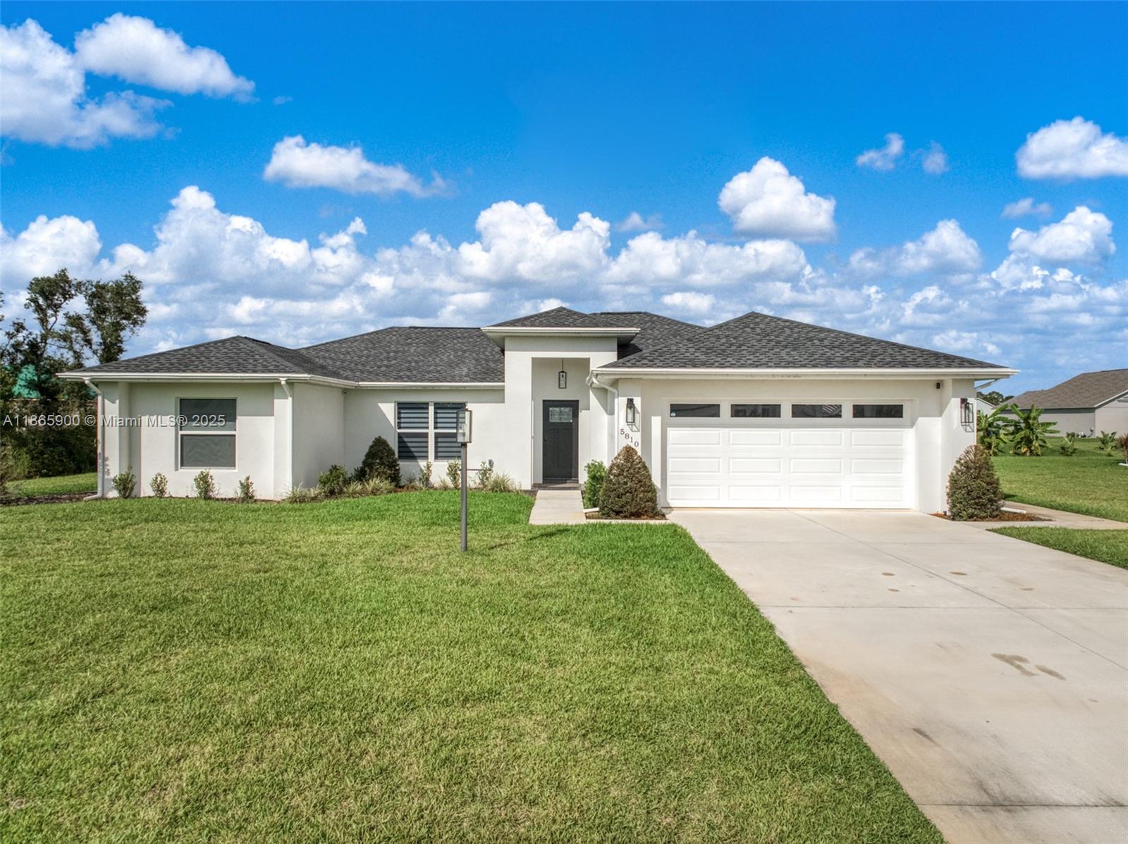 5810 Columbus Boulevard Sebring, FL 33872 - Photo 1 of 49 front view of a house with a yard