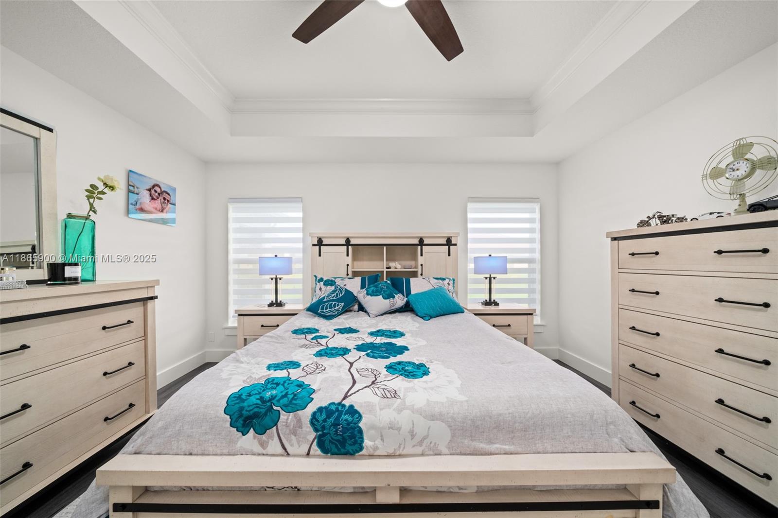 5810 Columbus Boulevard Sebring, FL 33872 - Photo 13 of 49 a bedroom with a bed and a dresser