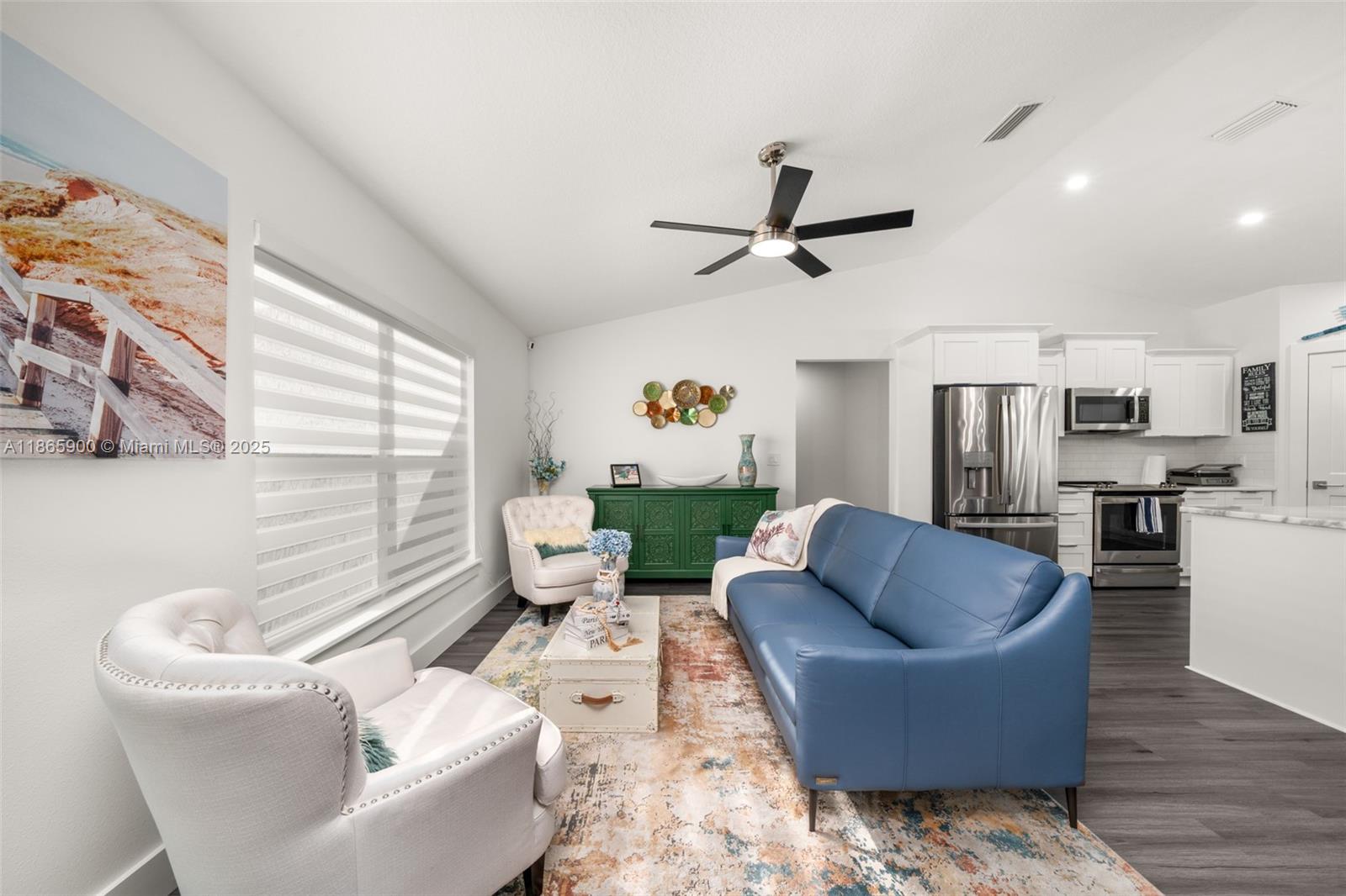 5810 Columbus Boulevard Sebring, FL 33872 - Photo 3 of 49 a living room with furniture kitchen view and a window