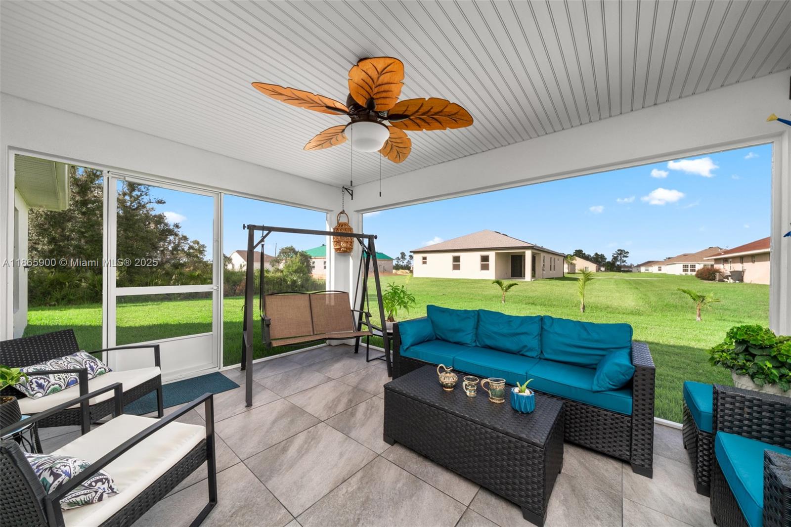 5810 Columbus Boulevard Sebring, FL 33872 - Photo 31 of 49 a balcony with furniture and a garden