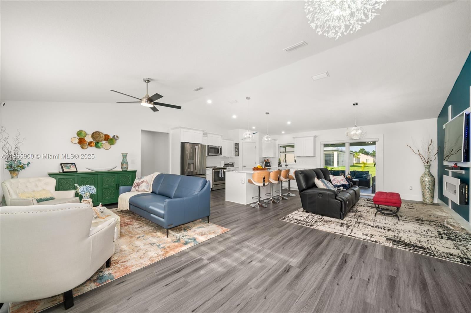 5810 Columbus Boulevard Sebring, FL 33872 - Photo 4 of 49 a living room with furniture kitchen view and a wooden floor