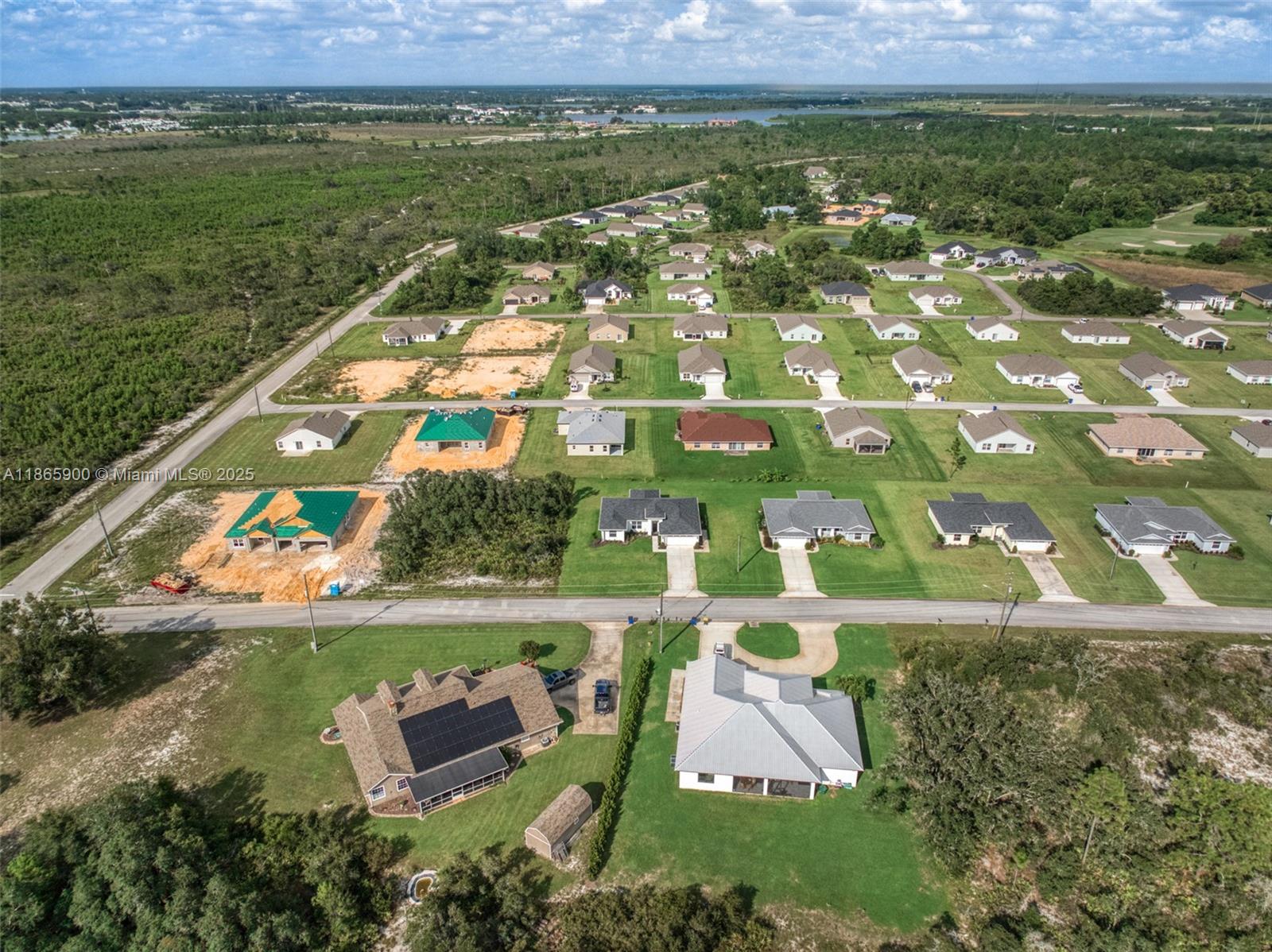 5810 Columbus Boulevard Sebring, FL 33872 - Photo 44 of 49 an aerial view of residential houses with outdoor space and trees