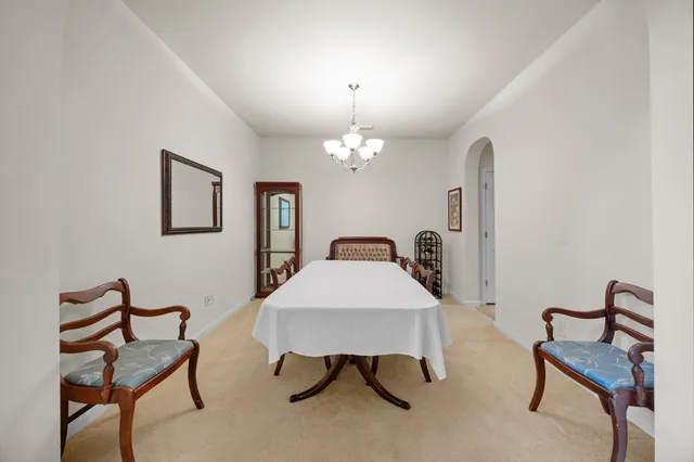 a kitchen with stainless steel appliances granite countertop a sink a stove and a microwave