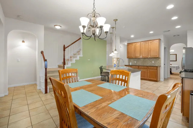a bed room with a bed and a ceiling fan