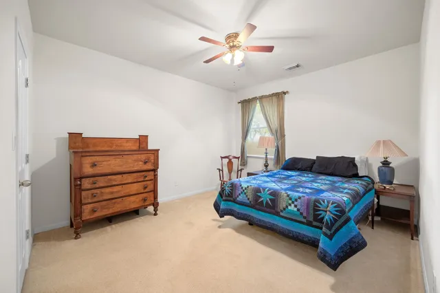 a view of a livingroom with furniture and a window