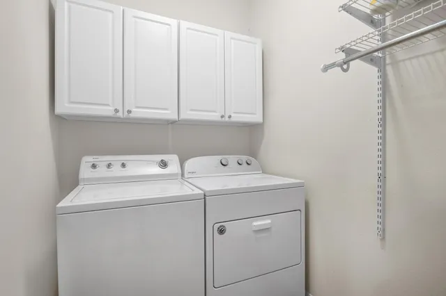 a bedroom with a bed and dresser