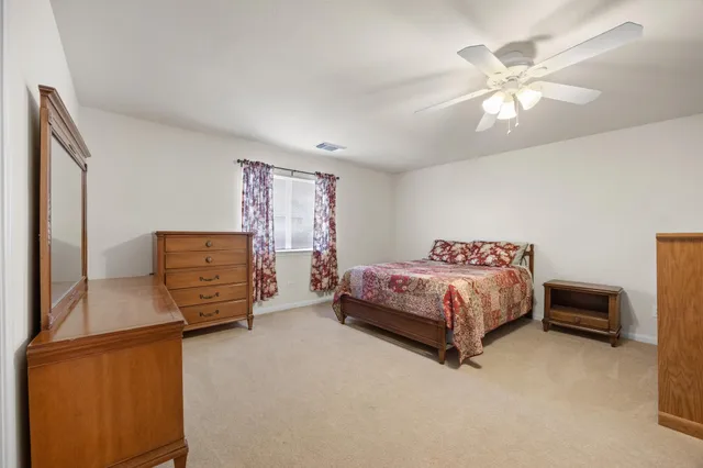 a bathroom with a sink a toilet and vanity