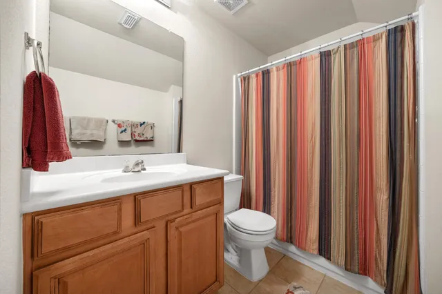 a view of a porch with wooden floor and outdoor seating