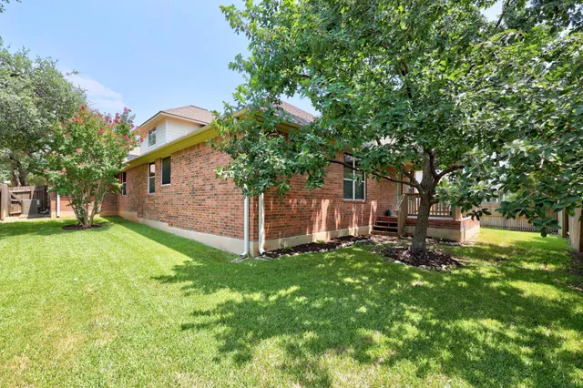 a view of a swimming pool and a yard