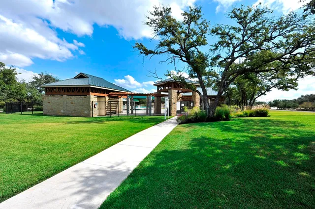 a view of a house with a yard porch and sitting area