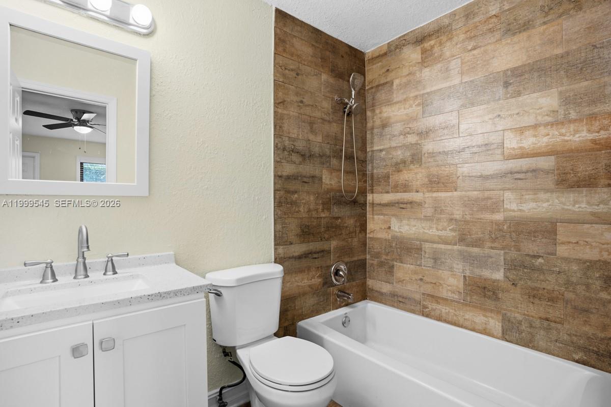 7604 Southwest 10th Court, Unit 2 Pompano Beach, FL 33068 - Photo 11 of 19 a bathroom with a sink a toilet and shower
