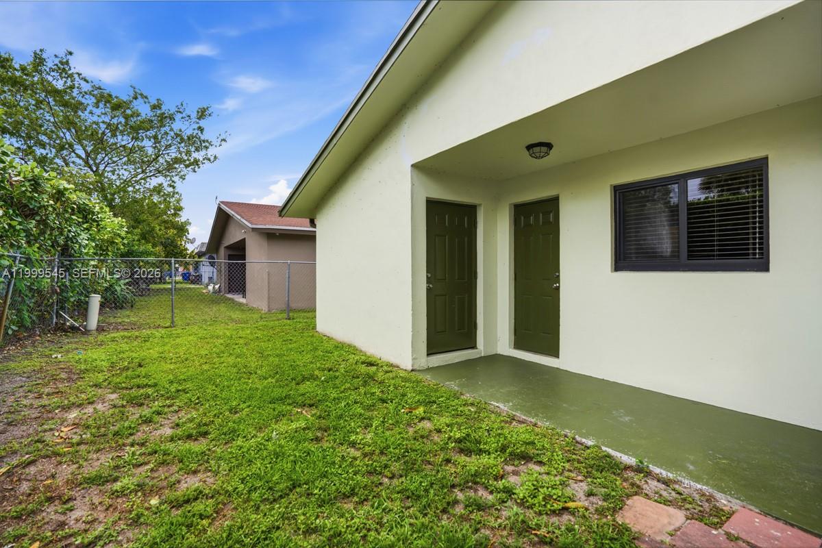 7604 Southwest 10th Court, Unit 2 Pompano Beach, FL 33068 - Photo 14 of 19 a view of a house with backyard