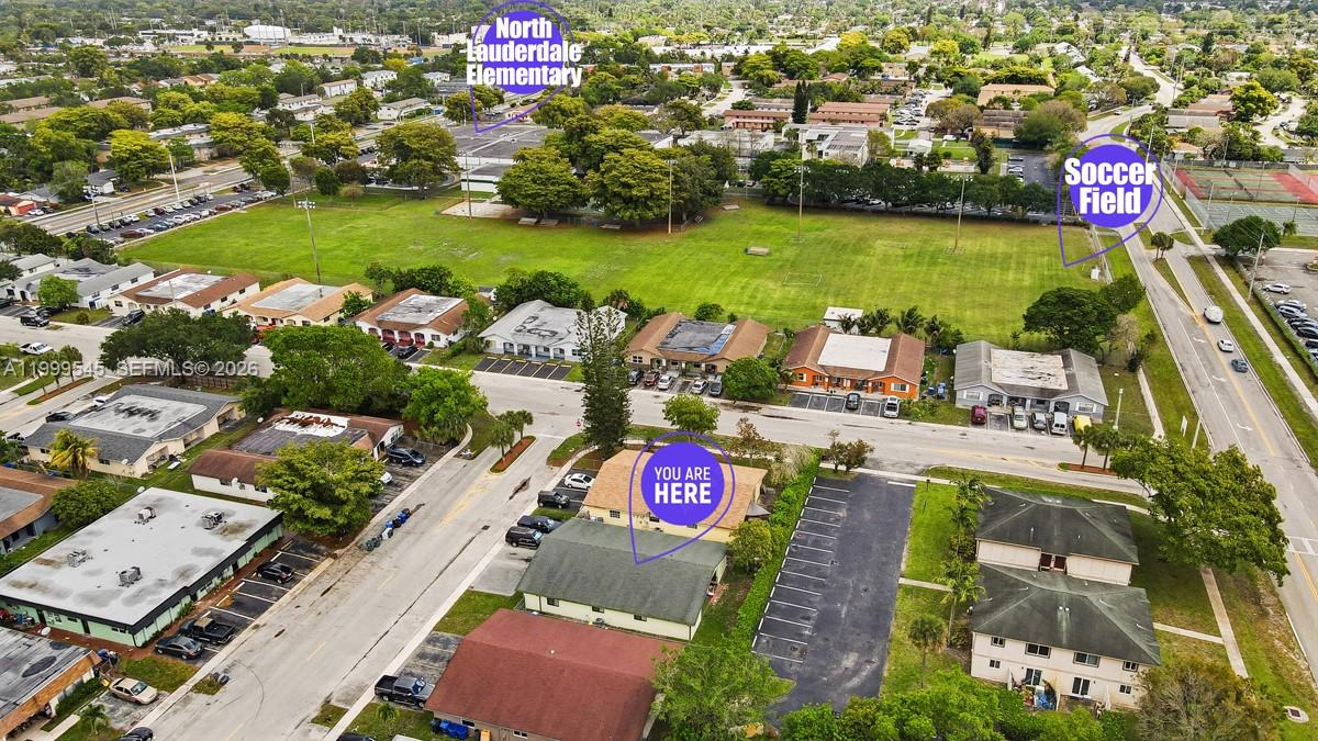7604 Southwest 10th Court, Unit 2 Pompano Beach, FL 33068 - Photo 17 of 19 an aerial view of residential houses with outdoor space and swimming pool