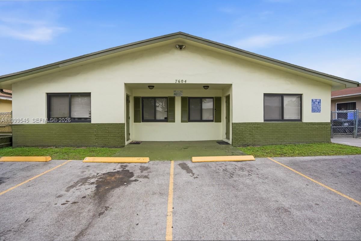 7604 Southwest 10th Court, Unit 2 Pompano Beach, FL 33068 - Photo 19 of 19 a view of an house with backyard space and tree