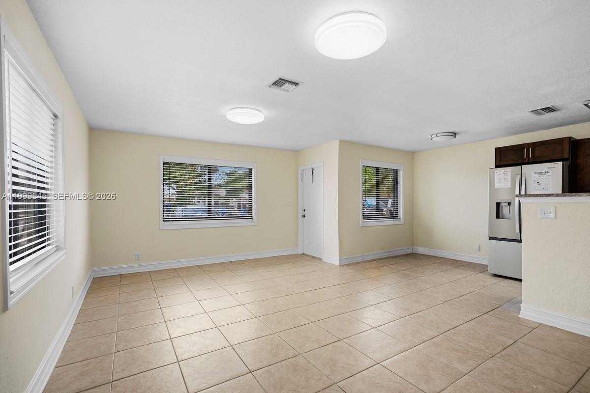 7604 Southwest 10th Court, Unit 2 Pompano Beach, FL 33068 - Photo 5 of 19 a view of an empty room with a window