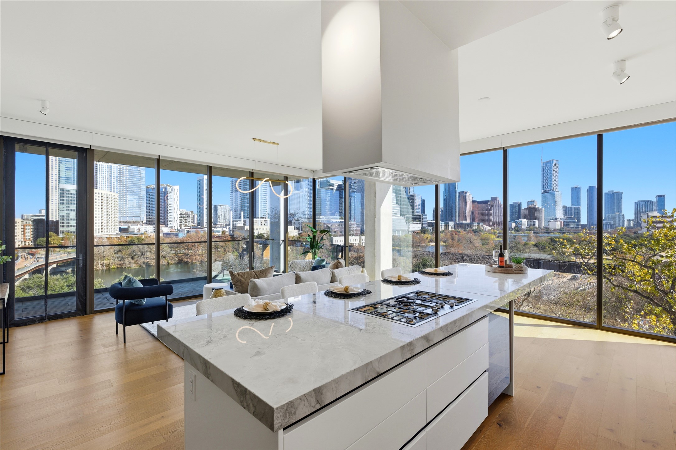 a kitchen with a large window and living room