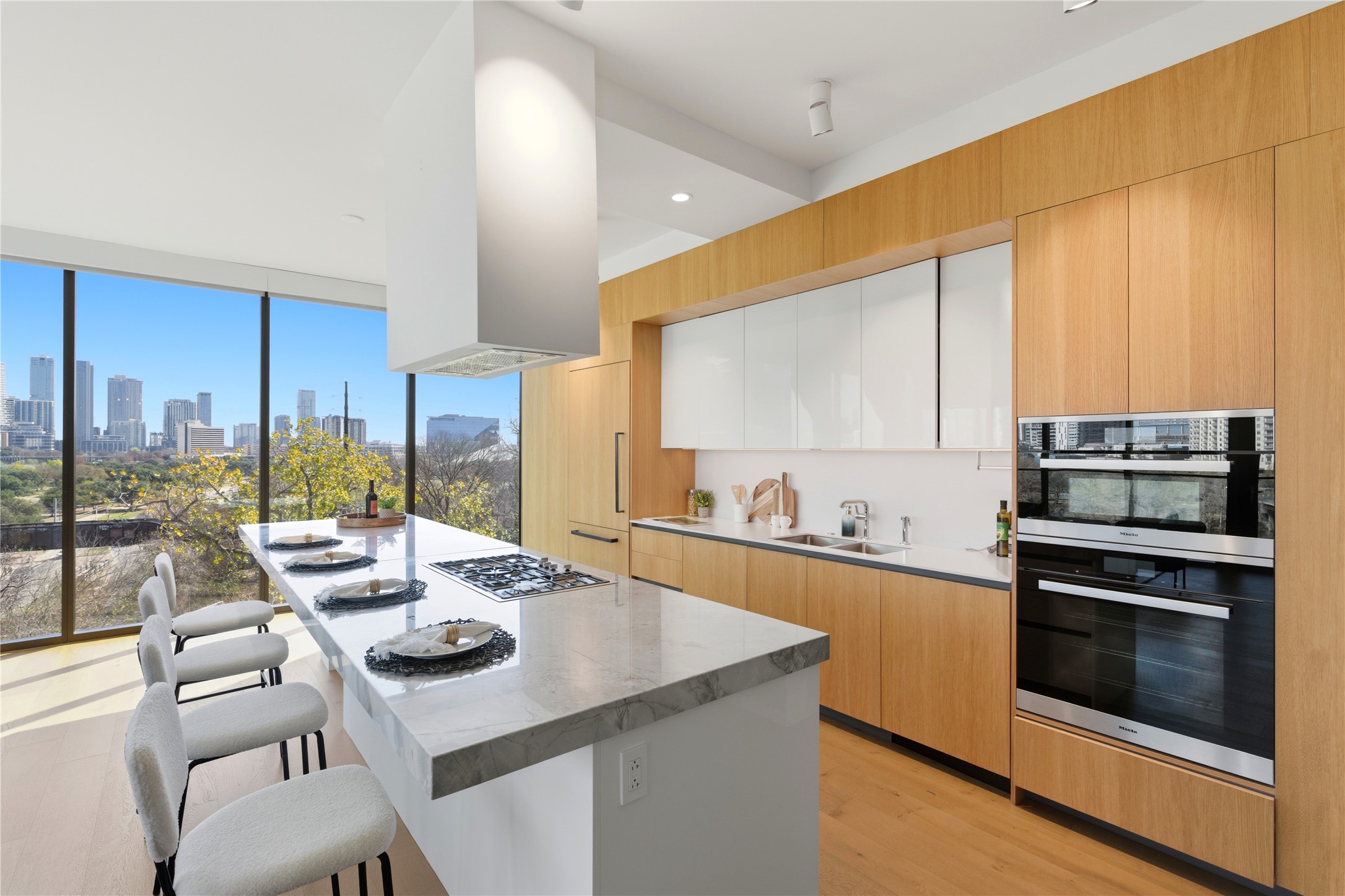 1211 West Riverside Drive, Unit 6B Austin, TX 78704 - Photo 9 of 40 a kitchen with a table chairs stove and kitchen island