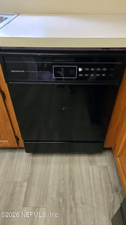 a stove top oven sitting inside of a kitchen