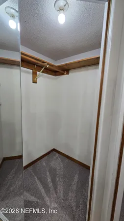 a spacious bathroom with a bathtub and shower