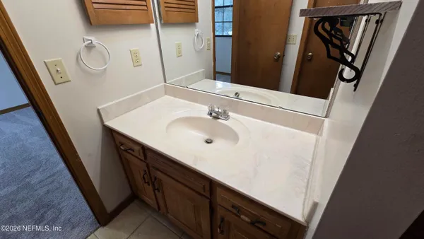 a bathroom with a shower and a sink