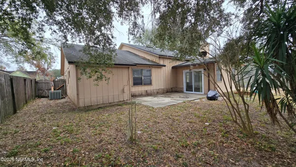 a view of a house with a tree