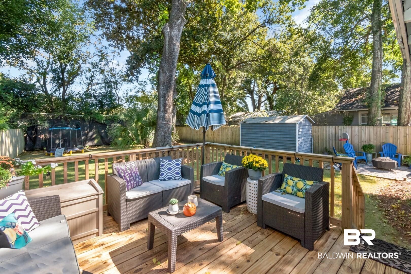 116 Item Avenue Mobile, AL 36607 - Photo 25 of 33 Wooden deck featuring a storage shed and an outdoor living space with a fire pit