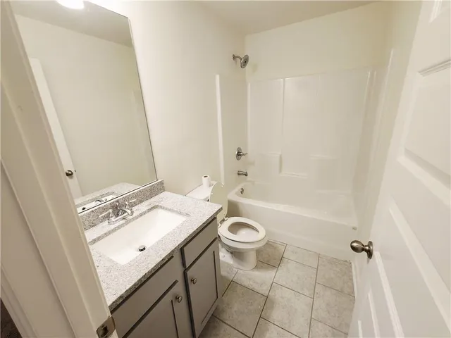 a front view of a house with a garage