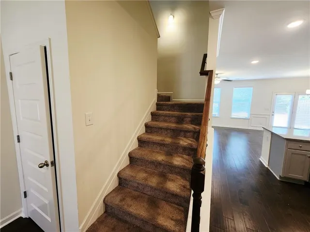a view of an entryway with wooden floor