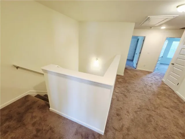 a view of a hallway with staircase