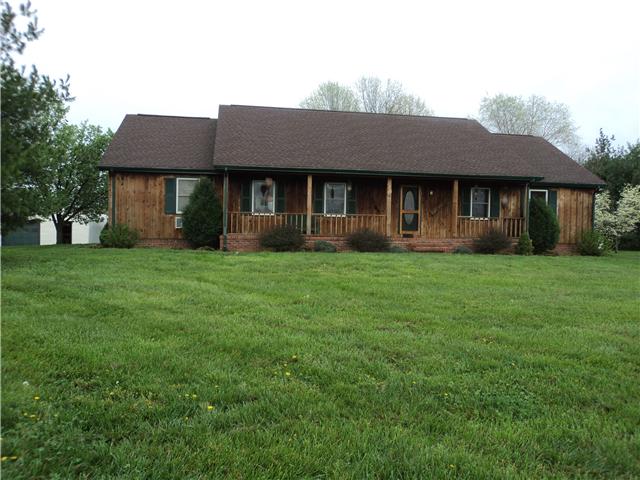 Custom home with 3 full baths on 5+ level acres!