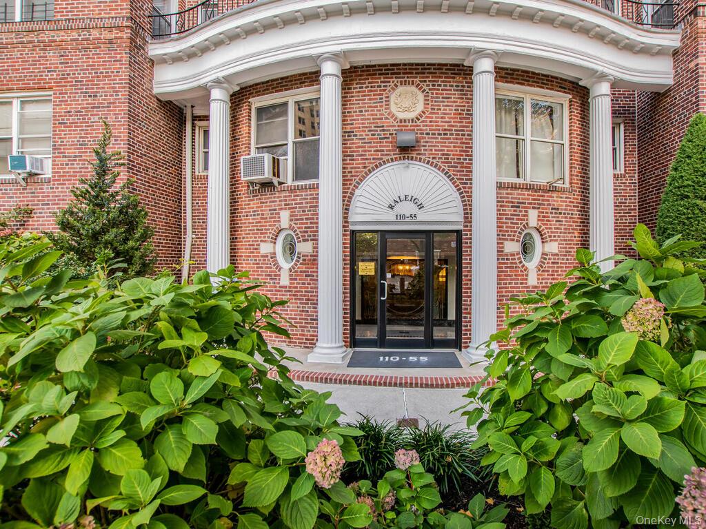 110-55 72nd Road, Unit 601 Queens, NY 11375 - Photo 12 of 14 a front view of a house with plants