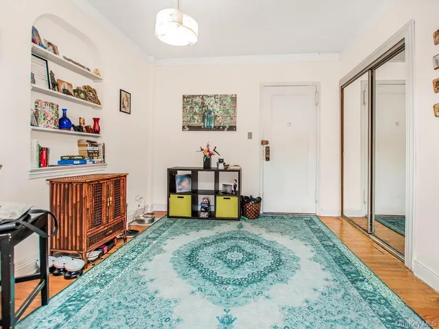 a bedroom with furniture and baby crib
