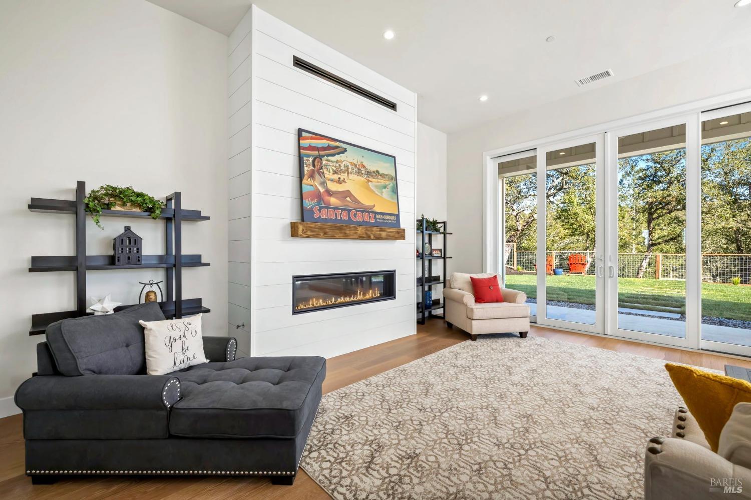 3712 Crown Hill Drive Santa Rosa, CA 95404 - Photo 12 of 71 Here is our view as we walk into the great room with fireplace, 12 ft ceiling and beautiful 10 ft high sliding glass doors that open to bring the outside in. Look at this view.