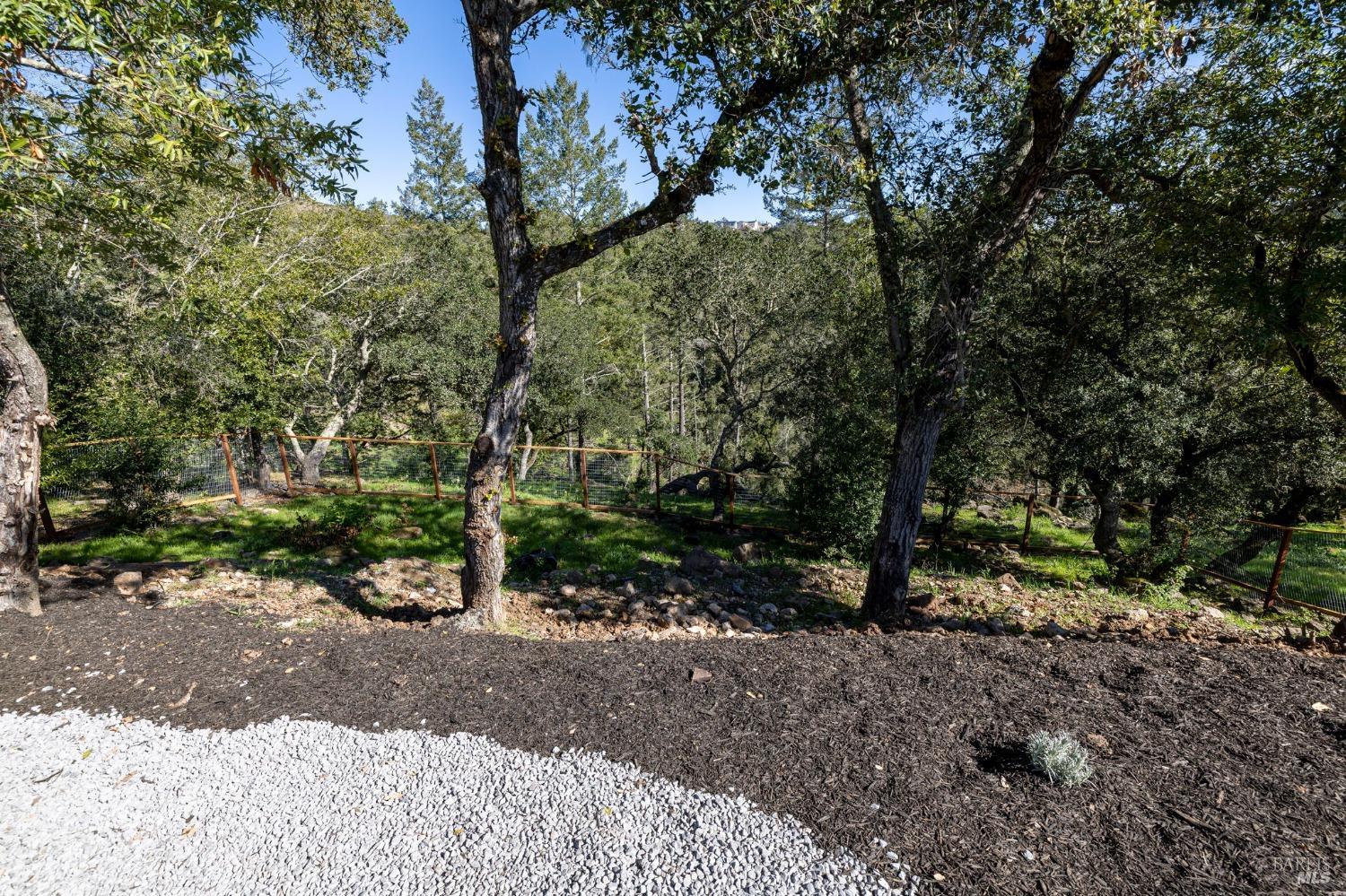 3712 Crown Hill Drive Santa Rosa, CA 95404 - Photo 33 of 71 Here is your view from the gate looking down to the lower fencing. Many potential possibilities to improve this lower area wait your imagination. The gravel in this photo leads from the gate to some steps to the left of this photo.