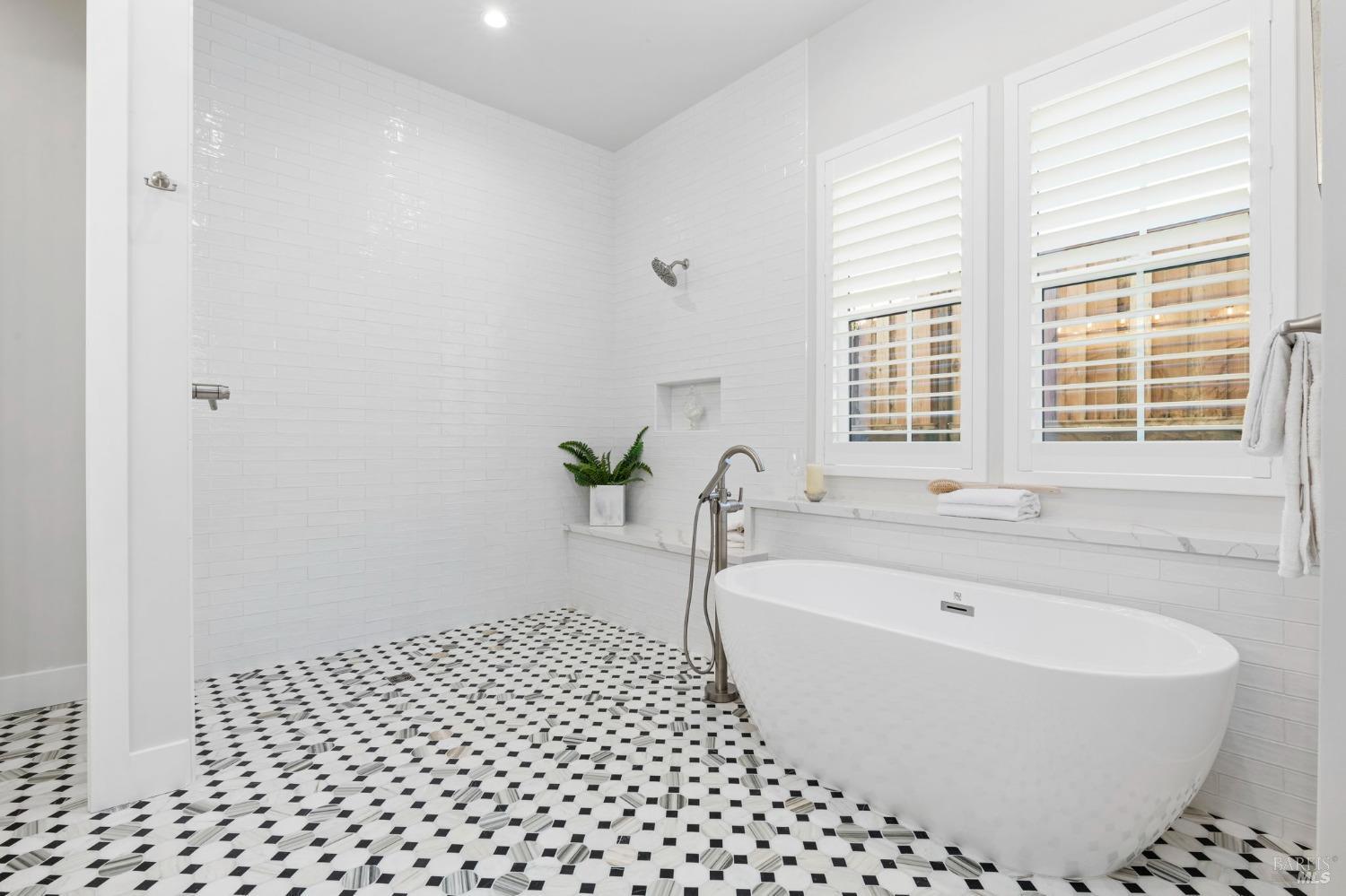 3712 Crown Hill Drive Santa Rosa, CA 95404 - Photo 45 of 71 Wow, look at the size of this shower with bench and floor to ceiling tile. Large freestanding tub for another added feature. The shower glass enclosure will be delivered and installed soon.