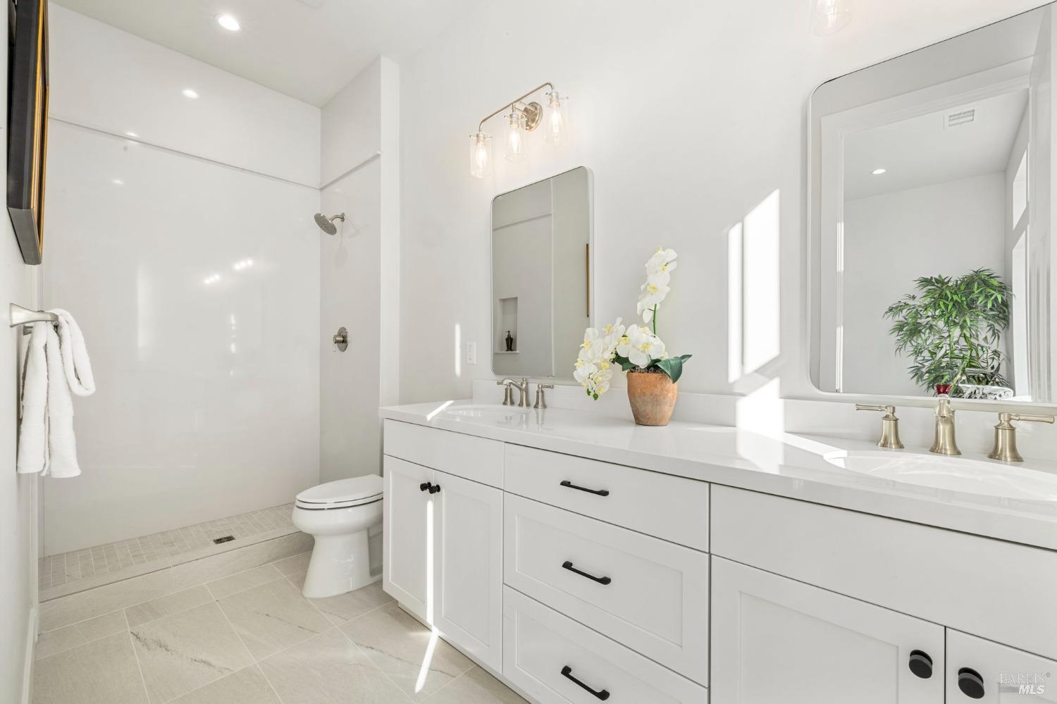 3712 Crown Hill Drive Santa Rosa, CA 95404 - Photo 55 of 71 Here is the view of the ensuite bathroom with floor to ceiling tile surround in the shower and dual sink vanity. Glass shower doors to be installed soon.