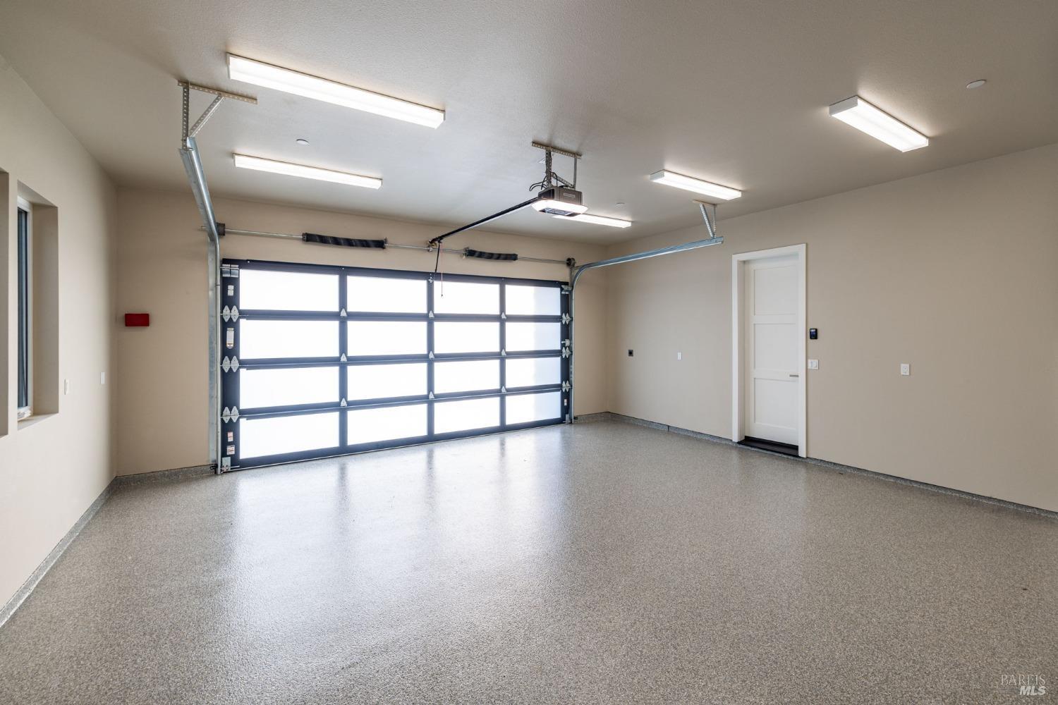 3712 Crown Hill Drive Santa Rosa, CA 95404 - Photo 61 of 71 Here is the view of your oversized 2 car garage as seen from the front entry hallway of your new home. This garage offers an epoxy floor finish, large area for a workshop and stainless sink. The garage door opener with remotes can be programmed to open and close from your cellphone and comes with a battery back up.